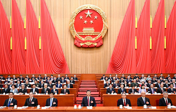十四届全国人大三次会议在京开幕 习近平...